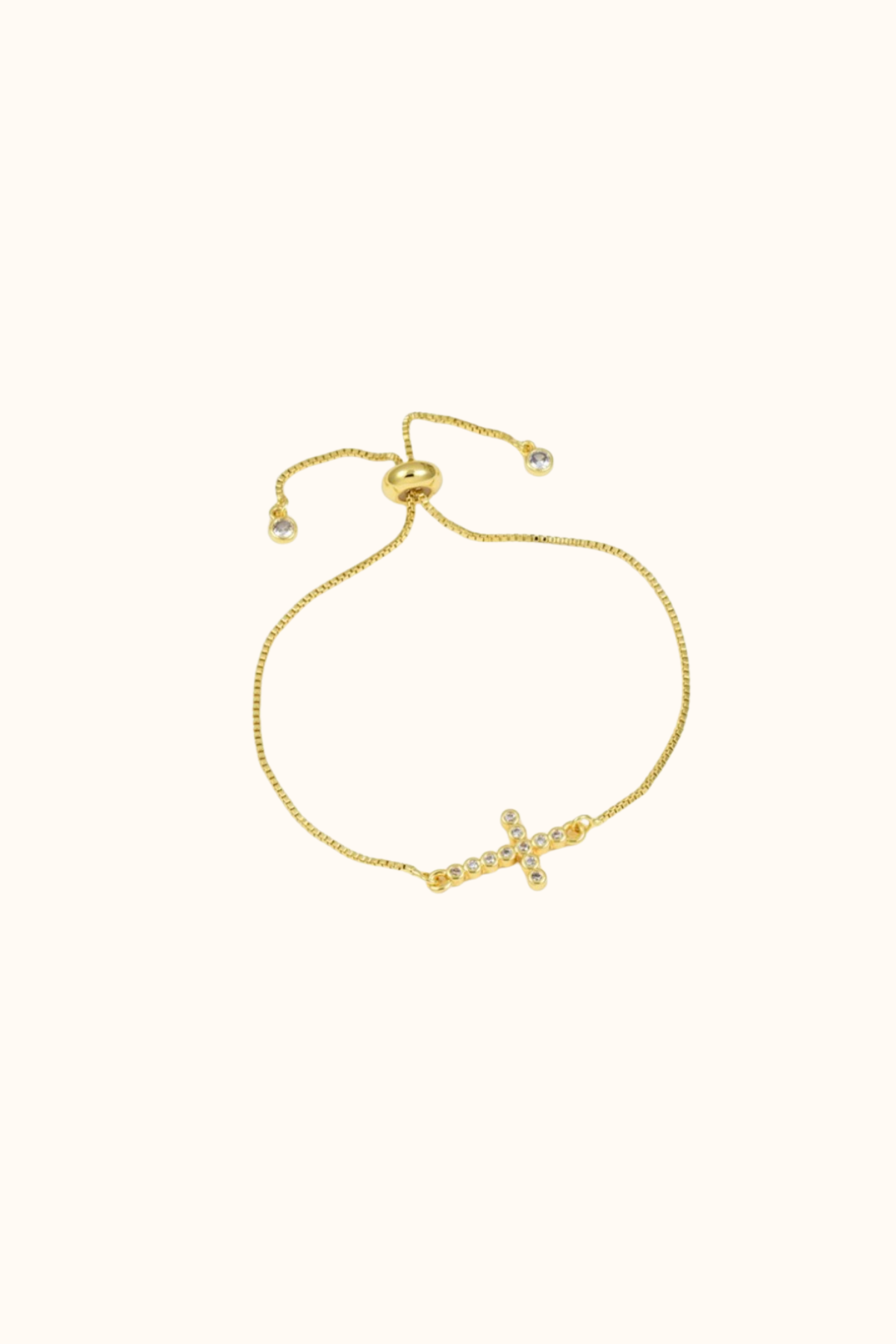 Delicate cross bracelet gold